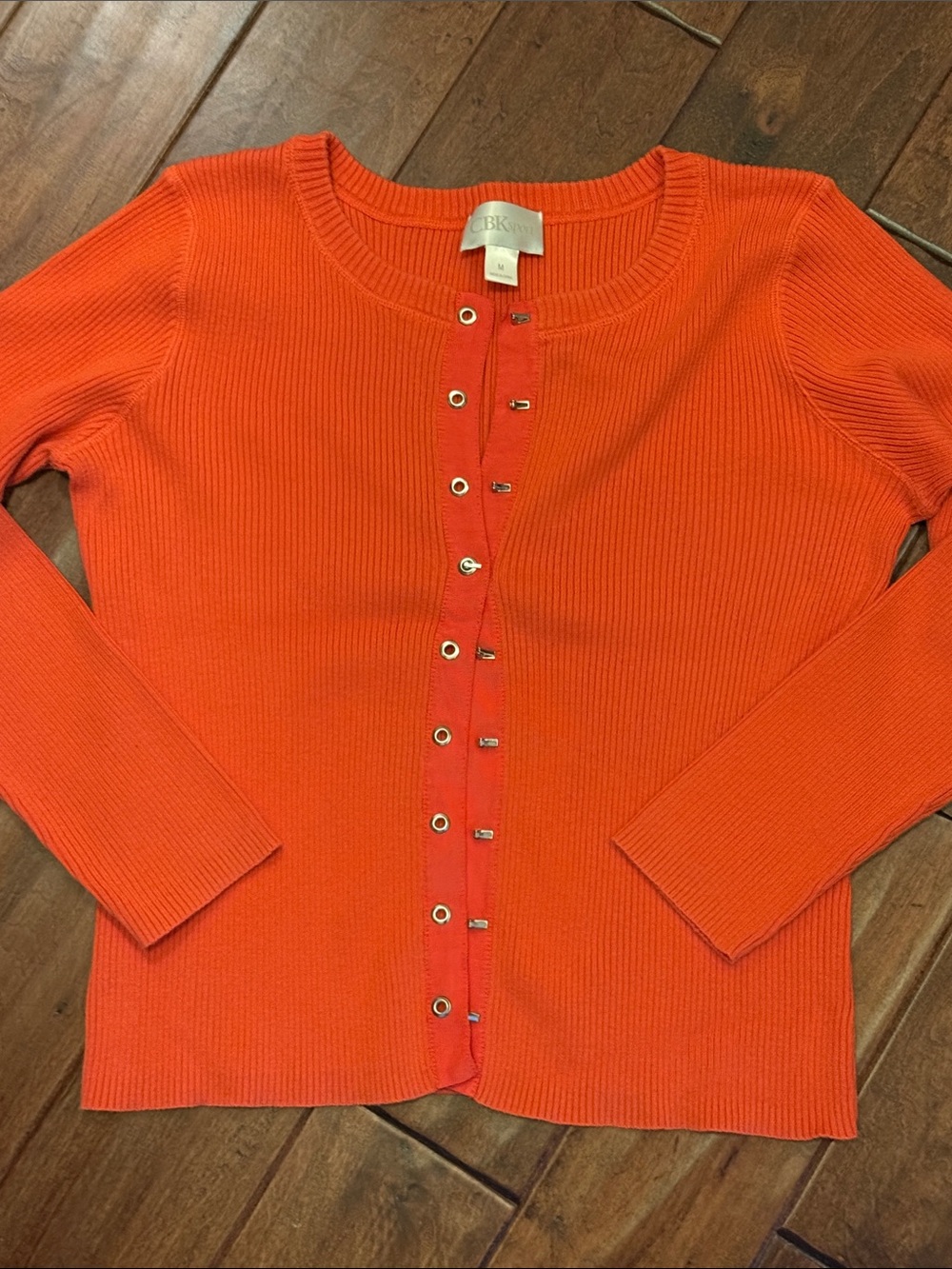 CBK Studio orange ribbed cardigan sweater with metal “buttons”